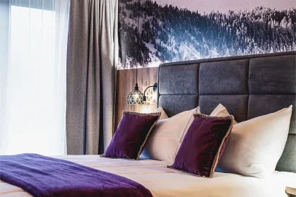 Chalet Mozart open-plan living area with floor-to-ceiling glass High Tauern views